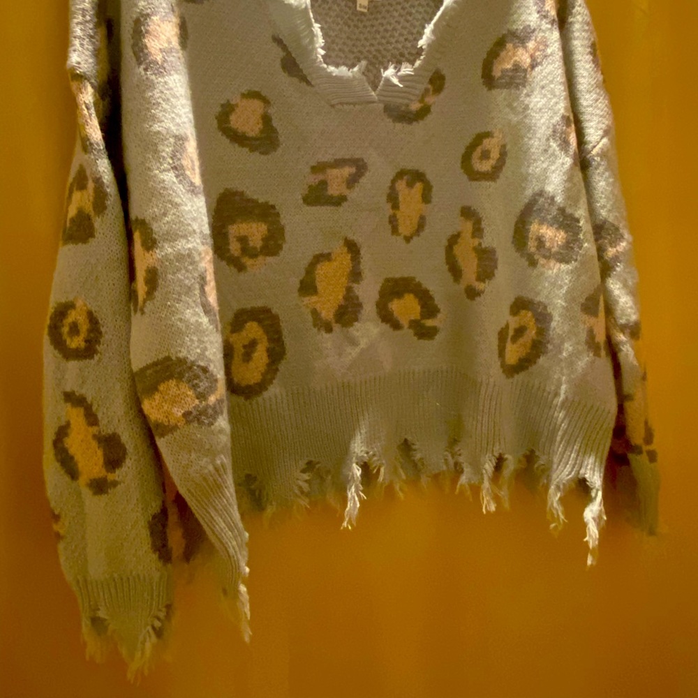 NEW - Cute distressed baby blue sweater size small/medium but runs large.